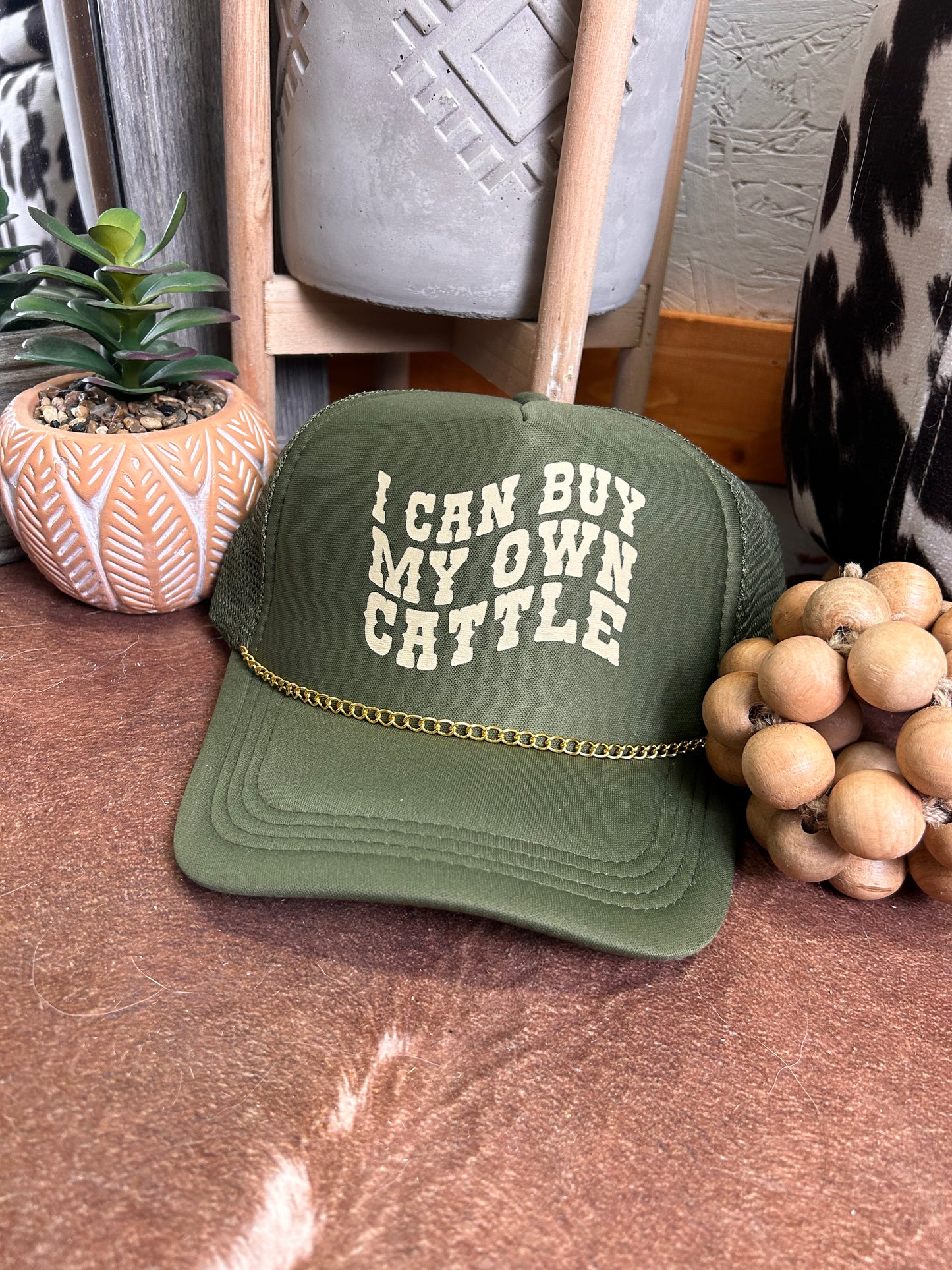 I can buy my own cattle Trucker Hat